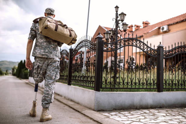 istock Soldier with amputee leg on his way home 1136258167