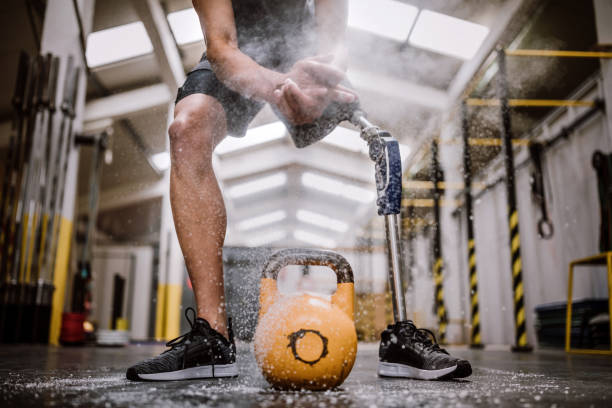 istock Amputee Athlete Putting On Sports Chalk Before Lifting Weights 1136258217