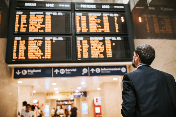 istock Man Looking at Railroad Station Platform 1136260377