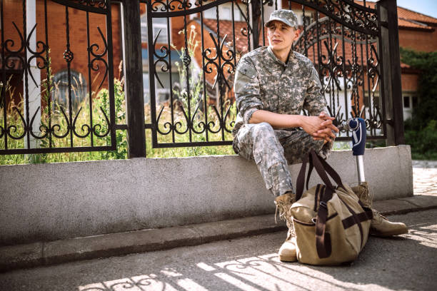 istock Soldier with amputee leg waiting for transport 1136260661