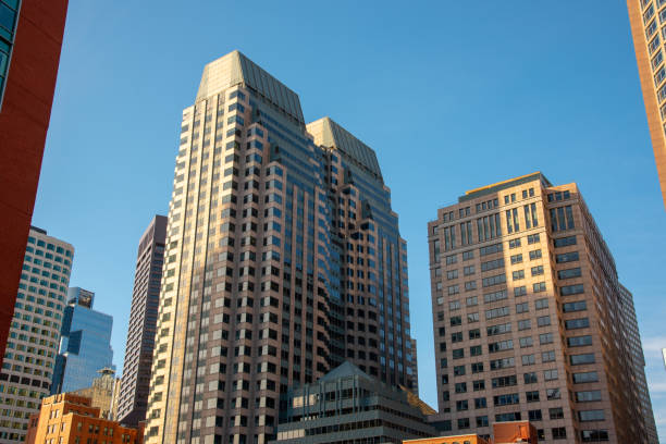 Boston financial district skyline from the Harborwalk Boston funded in 1630, is one of the oldest cities in the United States harborwalk stock pictures, royalty-free photos & images