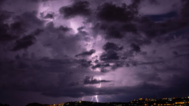 istock The coming storm illuminates the city. 1136266712