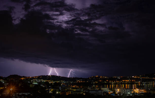 istock The coming storm illuminates the city. 1136266734