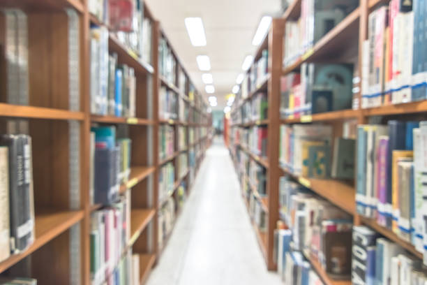 istock Blur school library or study room with book shelves for education background 1136269261