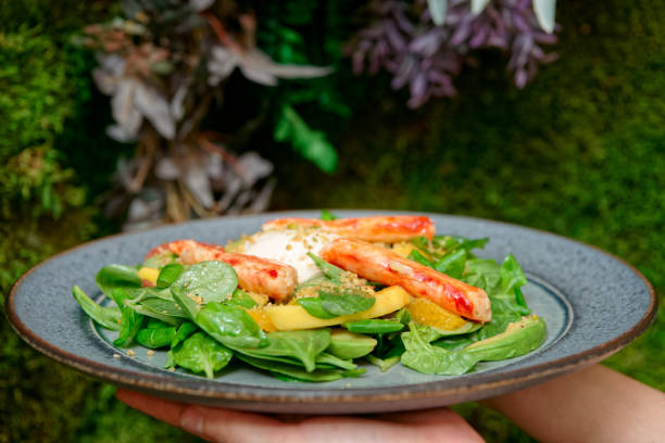 istock Woman holding salad with crab meat 1136269480