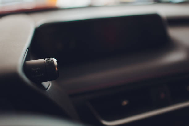 istock Dark luxury car Interior - steering wheel, shift lever and dashboard. 1136269682