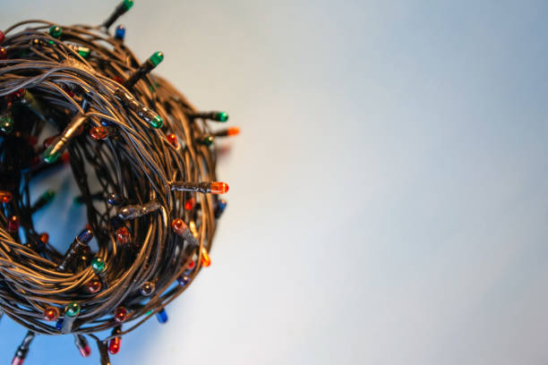 istock a hank of multi-colored Christmas garland on a blue background, copyspace 1136271250