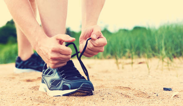 istock Runner preparing to go for a jog outdoors 1136275102