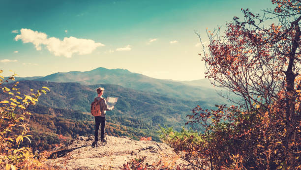 istock Man at the edge of a cliff 1136275134