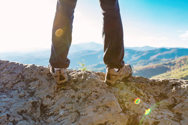istock Man at the edge of a cliff 1136275152