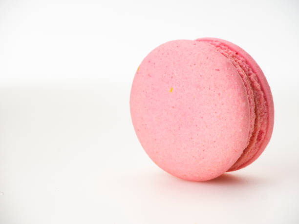 istock Sweet hazelnut Pink macaroon isolated on white background. 1136278559