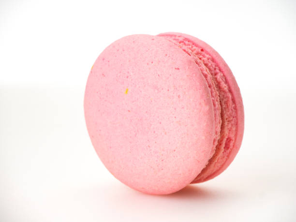 istock Sweet hazelnut Pink macaroon isolated on white background. 1136278561