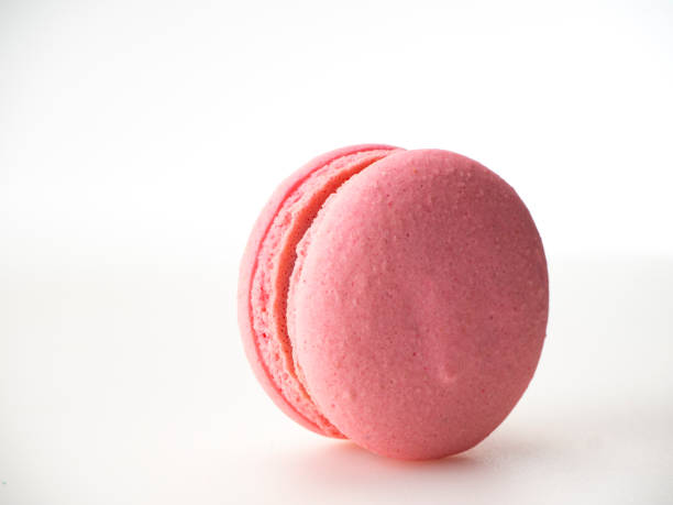 istock Sweet hazelnut Pink macaroon isolated on white background. 1136278568
