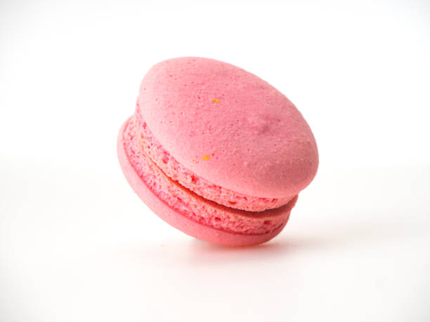 istock Sweet hazelnut Pink macaroon isolated on white background. 1136278577