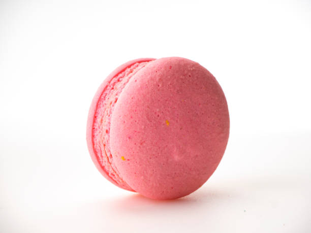 istock Sweet hazelnut Pink macaroon isolated on white background. 1136278581