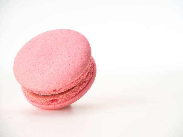 istock Sweet hazelnut Pink macaroon isolated on white background. 1136278585