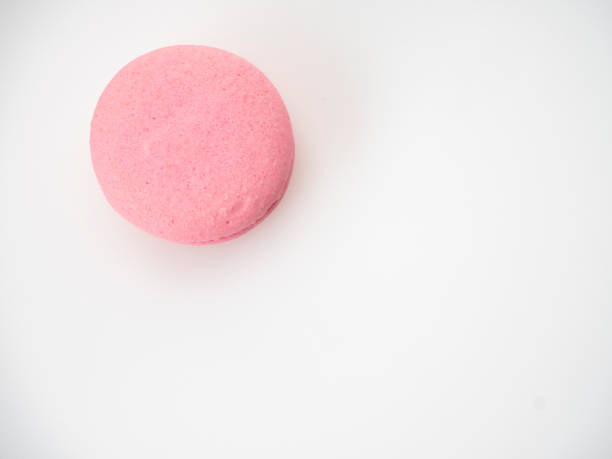 istock Sweet hazelnut Pink macaroon isolated on white background. 1136278588