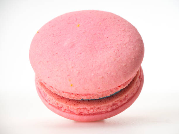 istock Sweet hazelnut Pink macaroon isolated on white background. 1136278593