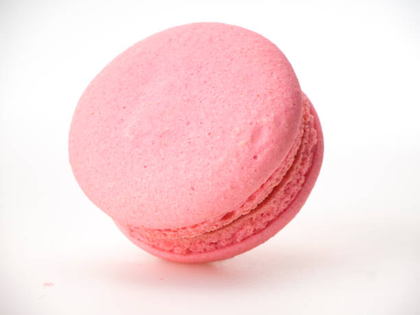 istock Sweet hazelnut Pink macaroon isolated on white background. 1136278594