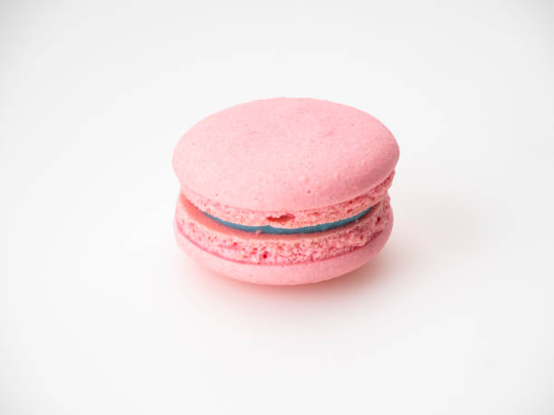 istock Sweet hazelnut Pink macaroon isolated on white background. 1136278597