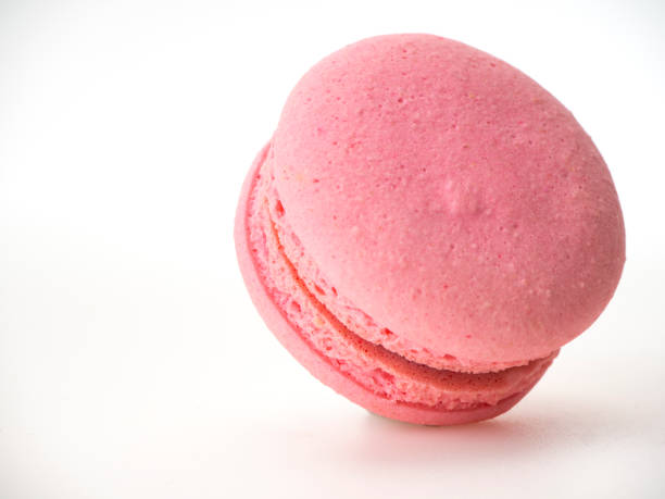 istock Sweet hazelnut Pink macaroon isolated on white background. 1136278611