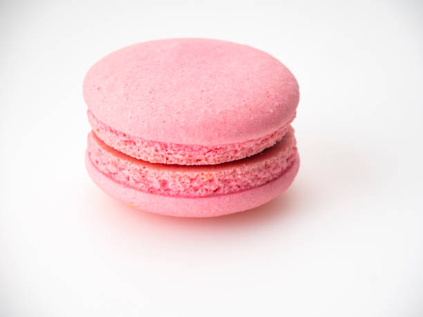 istock Sweet hazelnut Pink macaroon isolated on white background. 1136278613
