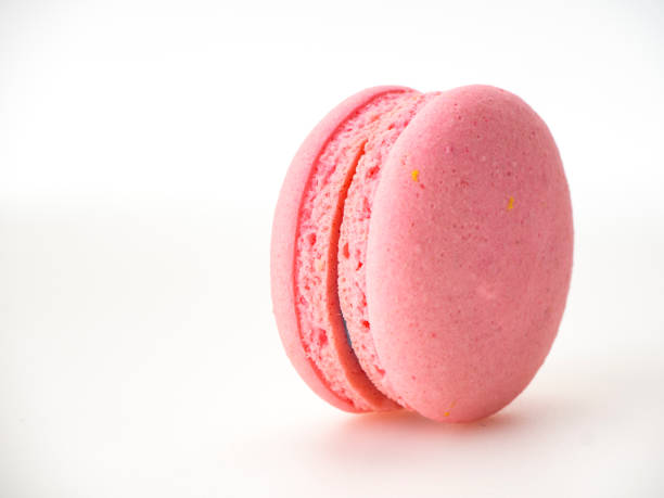 istock Sweet hazelnut Pink macaroon isolated on white background. 1136280045