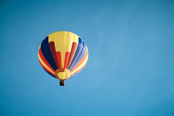 istock Colorful hot air balloon in the blue sky 1136282099