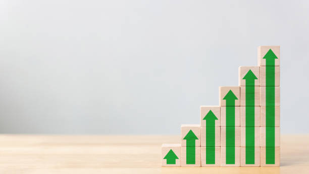 istock Ladder career path for business growth success process concept.Wood block stacking as step stair with arrow up 1136282417