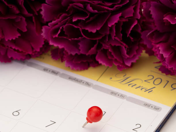 istock Women's Day on calendar with red pin 1136284096