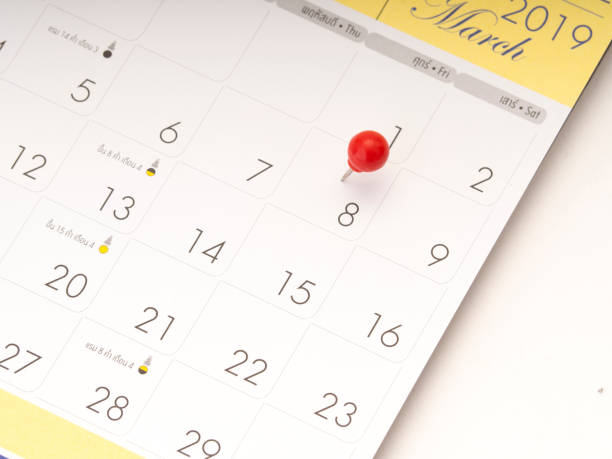 istock Women's Day on calendar with red pin 1136284108