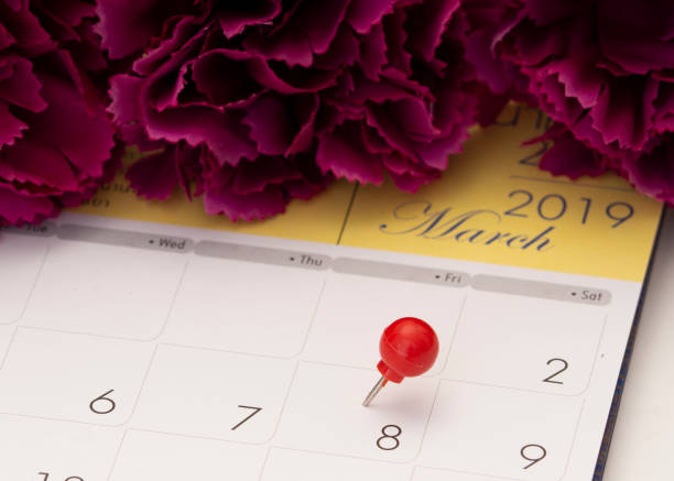 istock Women's Day on calendar with red pin 1136284109