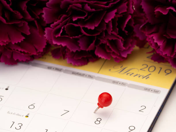 istock Women's Day on calendar with red pin 1136284127