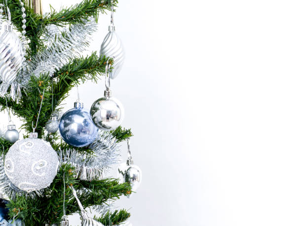 istock Silver Christmas decorations on a spruce branch 1136286175