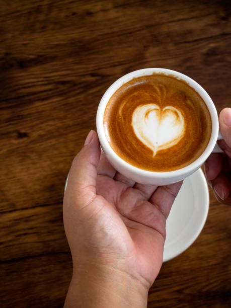 istock Hands and coffee of hot coffee lovers 1136286344