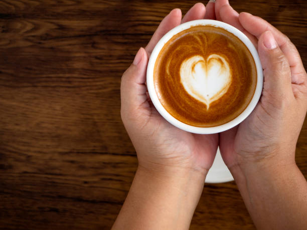 istock Hands and coffee of hot coffee lovers 1136286419