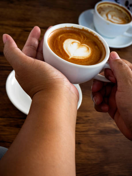 istock Hands and coffee of hot coffee lovers 1136286443