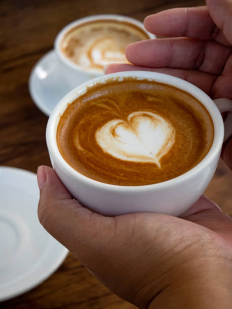 istock Hands and coffee of hot coffee lovers 1136286455