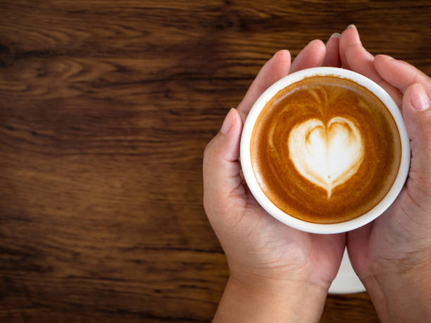 istock Hands and coffee of hot coffee lovers 1136286457