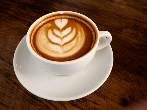 istock Coffee cup on wood texture and background 1136286471