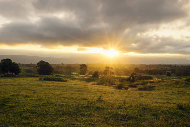 istock dramatic sunset scene in yard and mountain countryside  - can use to display or montage on product 1136288556
