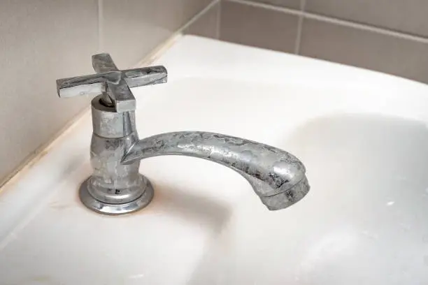 Photo of Dirty faucet with stain and limescale
