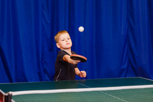 istock a boy seven years playing table tennis 1136294261