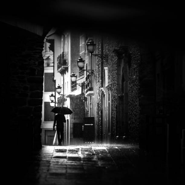 istock Man walking on the rain with umbrella Spain 1136294993