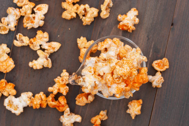 istock Popcorn in a bowl on wooden background. 1136302275