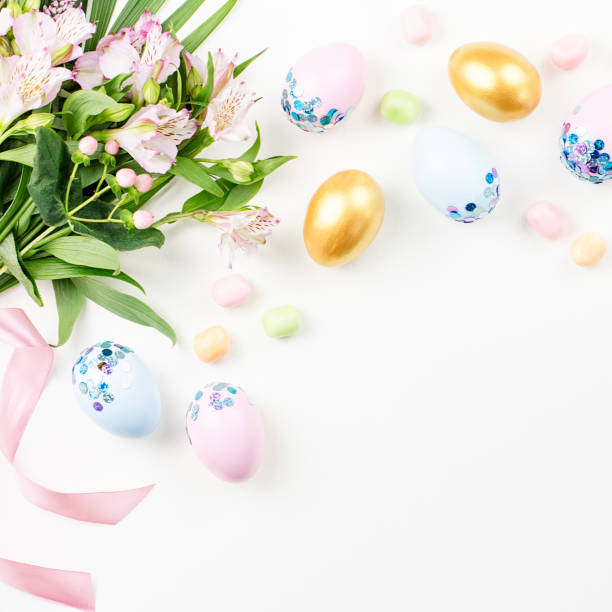 istock Festive Happy Easter background with decorated eggs, flowers, candy and ribbons in pastel colors on white. Copy space 1136305170