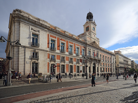 Madrid, Spain, May, 12, 2017. Real Casa de Correos (Royal Post office) at Puerta del Sol, Madrid, Spain. This building is at the most famous square of Madrid.