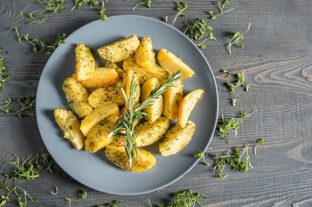 istock Fried potato wedges with herbs 1136315963