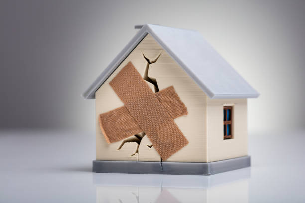 istock House Model With Crossed Band Aid 1136317157