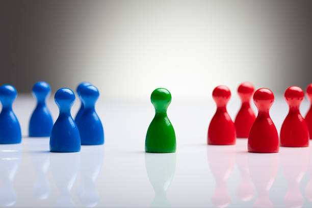 istock Colorful Pawns On The Reflective Desk 1136317168